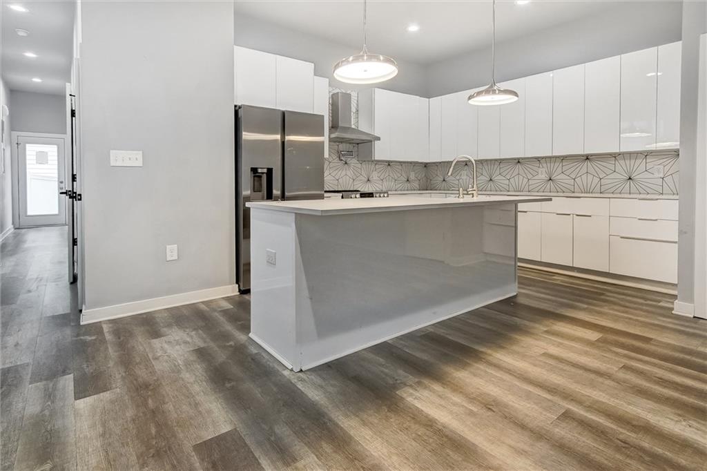 569 Middle Street Southwest Atlanta, GA 30310 - Photo 5 of 35 a kitchen with granite countertop a sink cabinets and stainless steel appliances