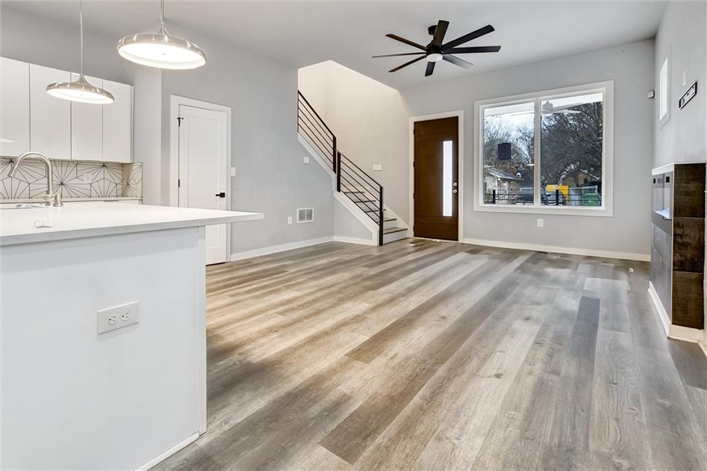569 Middle Street Southwest Atlanta, GA 30310 - Photo 7 of 35 a view of a kitchen with a sink and dishwasher kitchen view with wooden floor