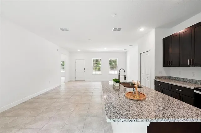 a view of a kitchen and kitchen island