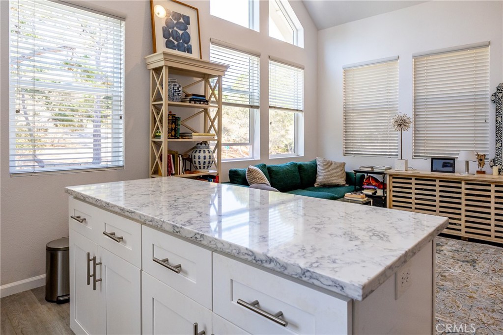 2070 Wales Road Cambria, CA 93428 - Photo 15 of 38 a kitchen with a granite countertop sink and windows