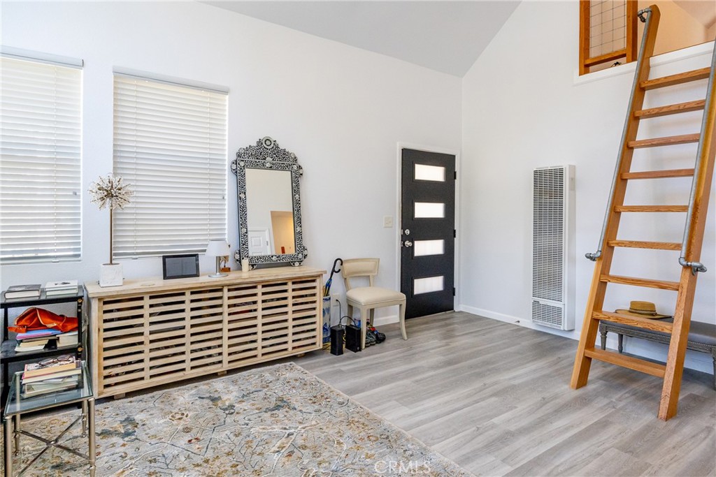 2070 Wales Road Cambria, CA 93428 - Photo 17 of 38 a view of an empty room with stairs and a window