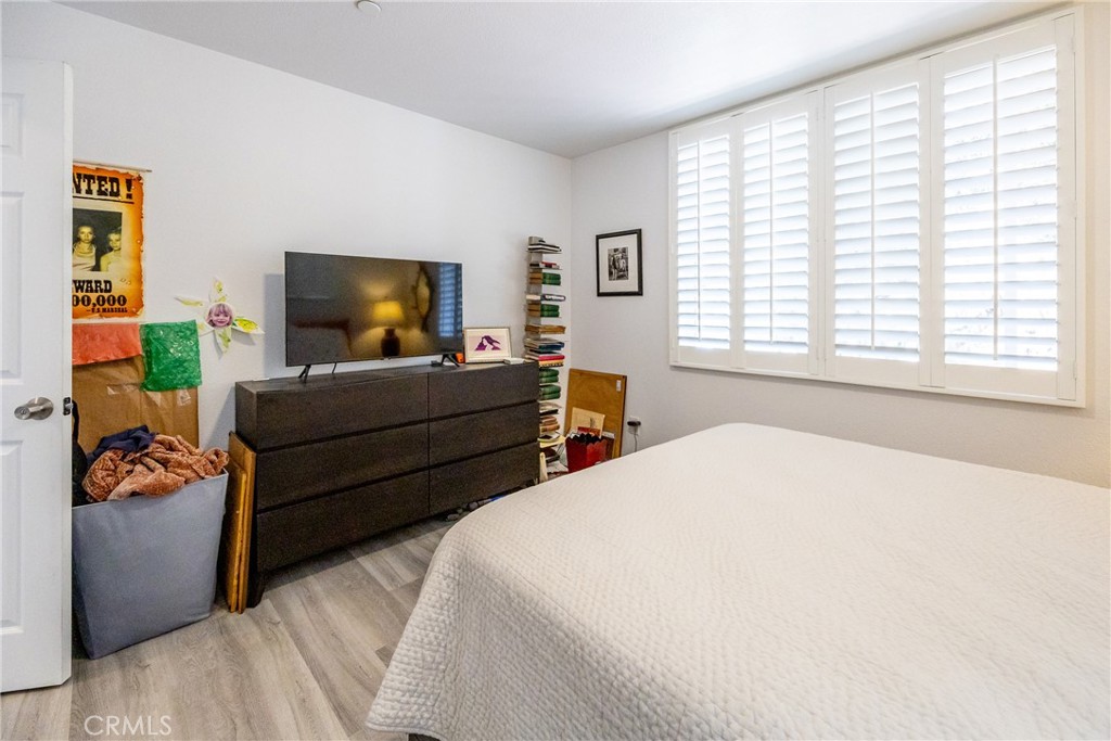 2070 Wales Road Cambria, CA 93428 - Photo 24 of 38 a bedroom with a bed and a flat screen tv