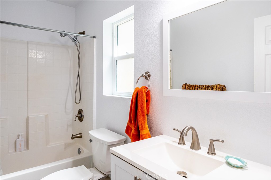 2070 Wales Road Cambria, CA 93428 - Photo 26 of 38 a bathroom with a sink and a mirror