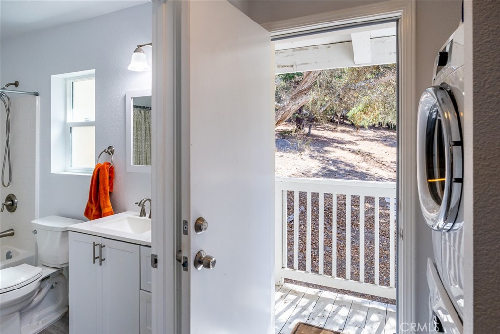 2070 Wales Road Cambria, CA 93428 - Photo 29 of 38 a view of walk in closet with clothes and shoes