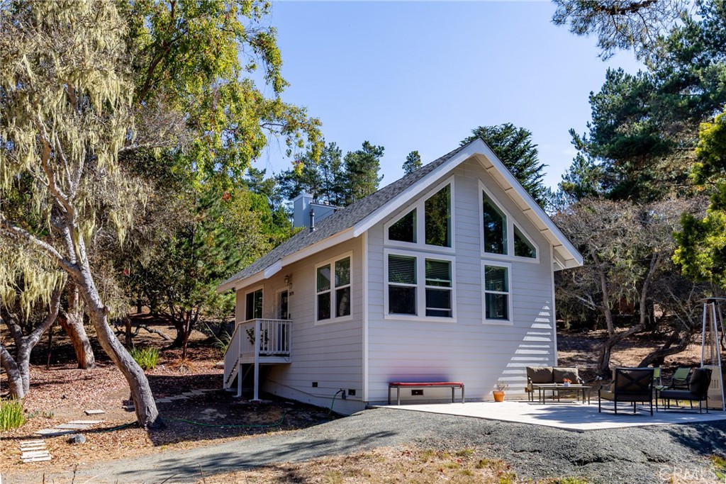 2070 Wales Road Cambria, CA 93428 - Photo 3 of 38 a front view of a house with garden