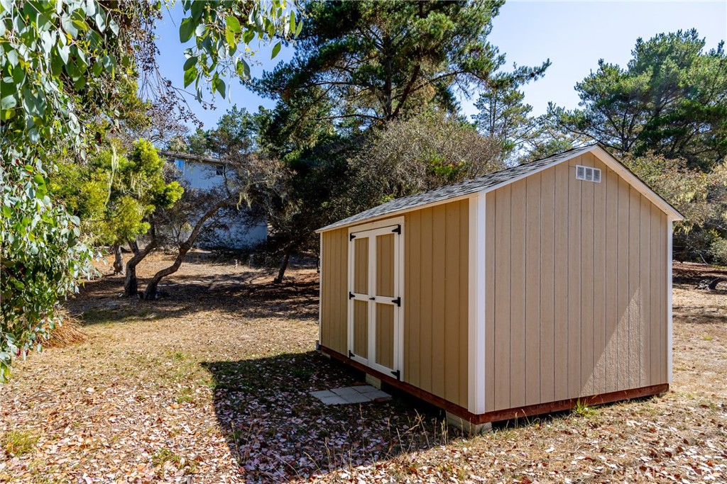 2070 Wales Road Cambria, CA 93428 - Photo 32 of 38 a view of a backyard with barn