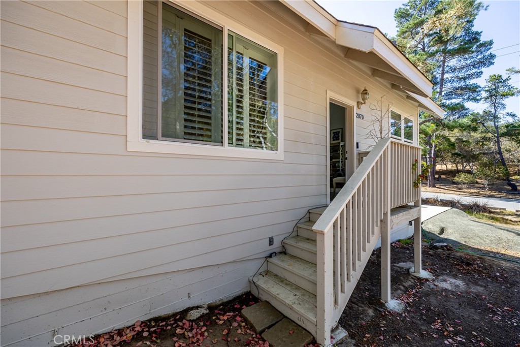 2070 Wales Road Cambria, CA 93428 - Photo 4 of 38 a view of a house with a deck