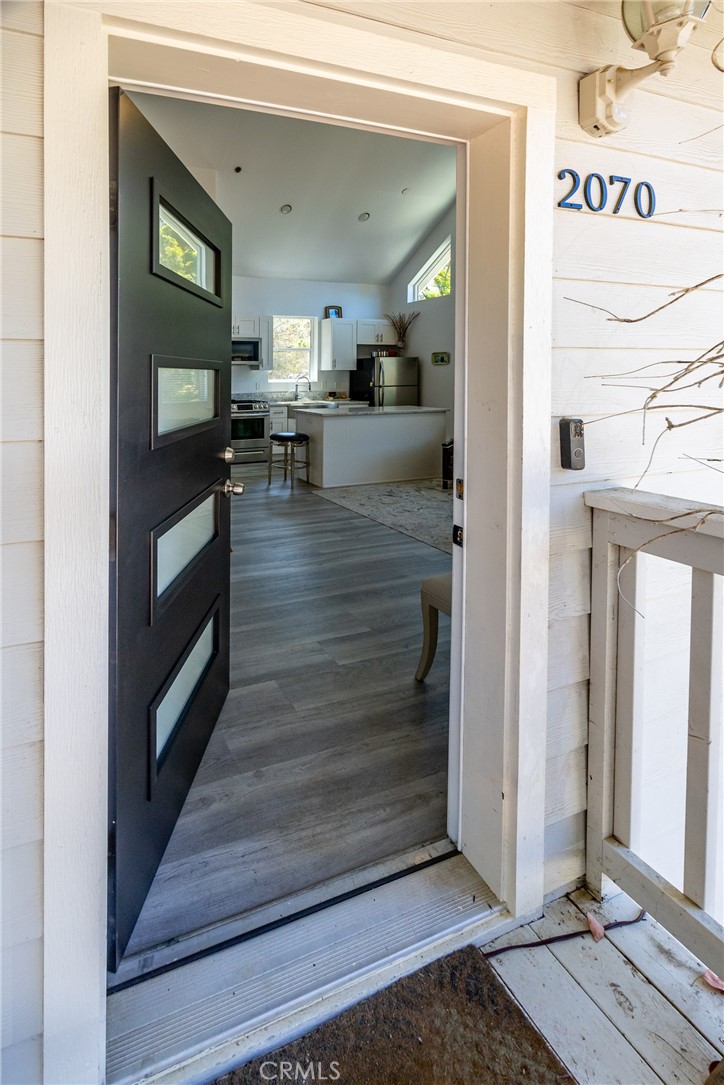 2070 Wales Road Cambria, CA 93428 - Photo 5 of 38 a view of living room with furniture and flat screen tv