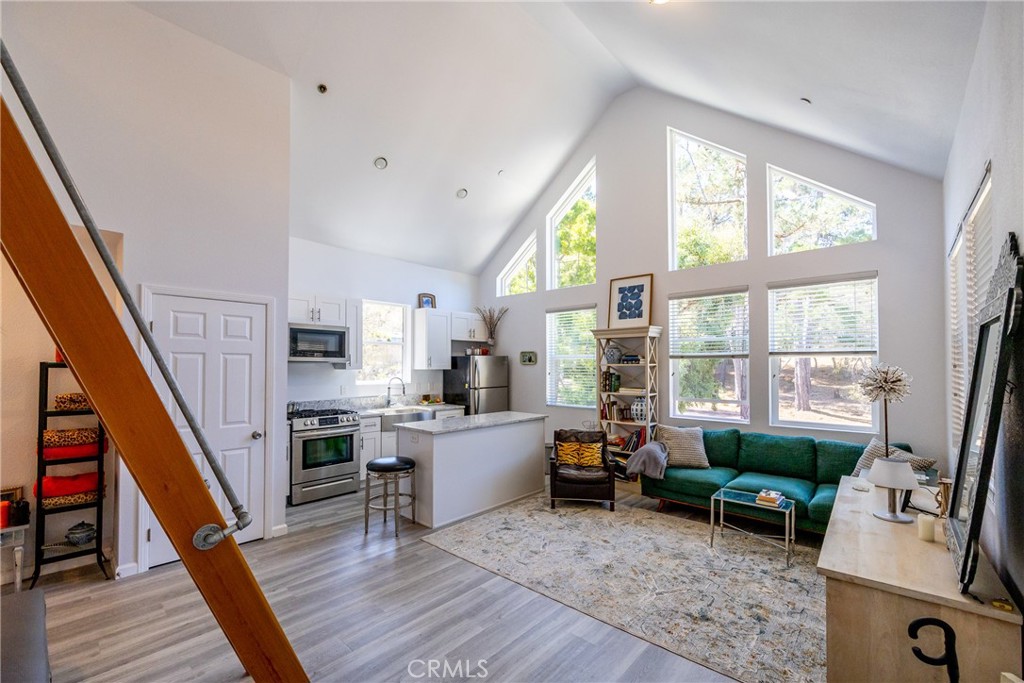 2070 Wales Road Cambria, CA 93428 - Photo 8 of 38 a living room with furniture and a wooden floor