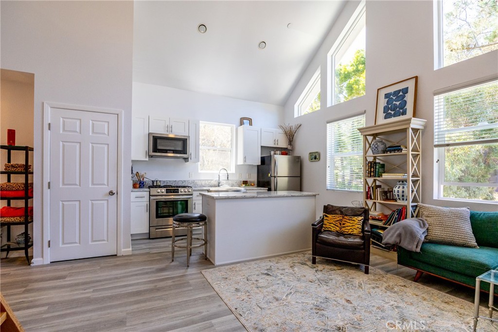 2070 Wales Road Cambria, CA 93428 - Photo 9 of 38 a living room with stainless steel appliances furniture and a kitchen view