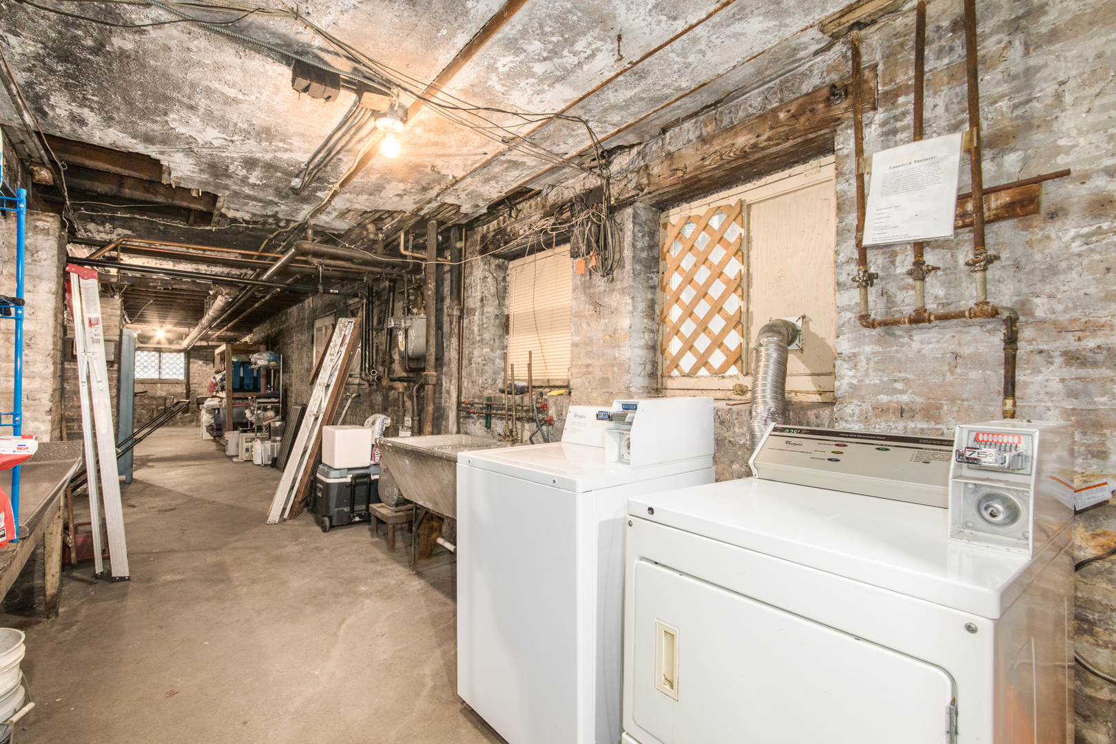 4117 North Paulina Street Chicago, IL 60613 - Photo 24 of 28 a view of storage and utility room with washer and dryer