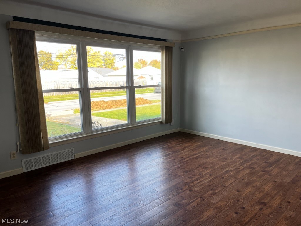 30824 Clarmont Road Willowick, OH 44095 - Photo 7 of 24 Empty room with dark hardwood / wood-style flooring
