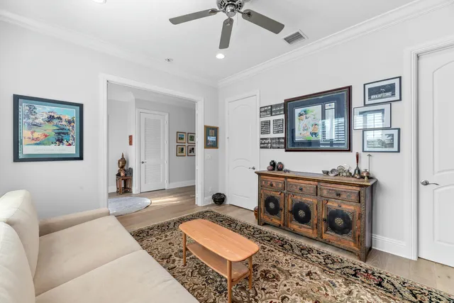 a bedroom with a bed furniture and a flat screen tv