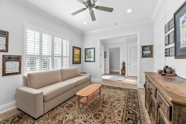 a spacious bedroom with a bed and a flat screen tv