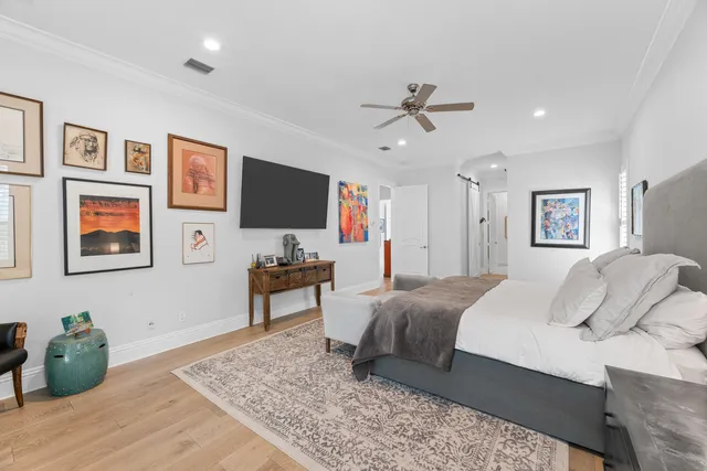 a bathroom with a sink a toilet a mirror and shower