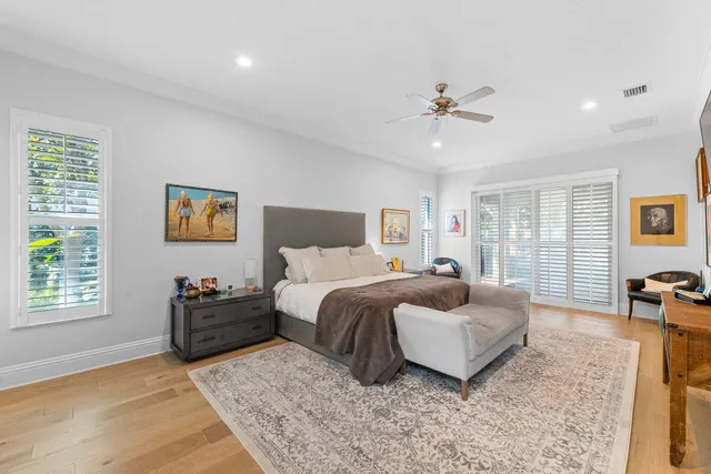 a bedroom with a bed a bookshelf and a book shelf