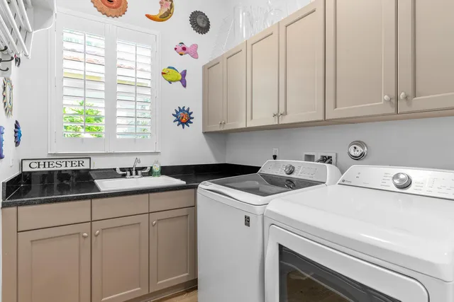 a view of a porch with chairs and backyard