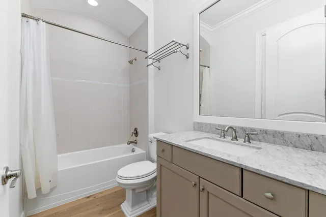 a view of an outdoor dining space with a table and chairs
