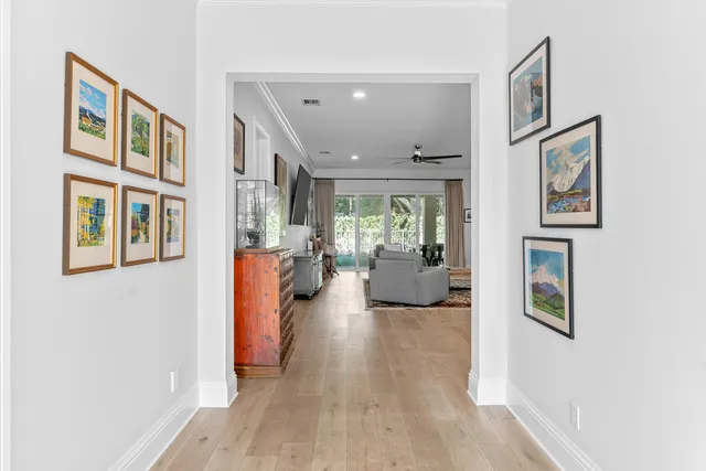a living room with furniture and a book shelf