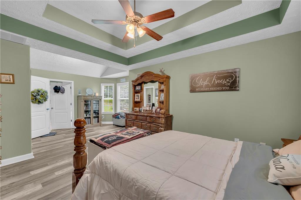587-j B J B Owens Road Bethlehem, GA 30620 - Photo 40 of 99 a bedroom with a bed furniture and wooden floor