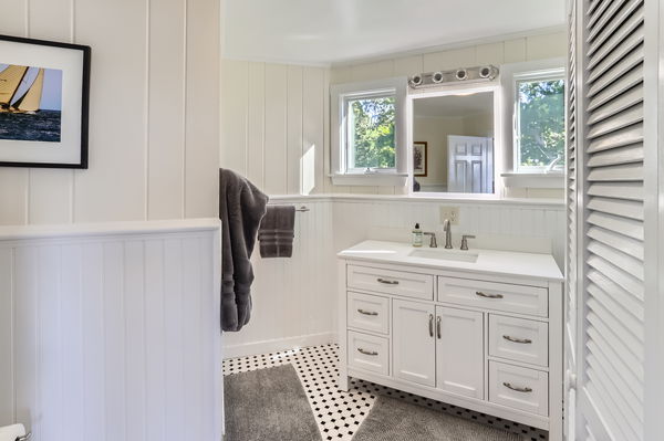 217 Barnes Road Oak Bluffs, MA 02557 - Photo 14 of 60 a bathroom with a double vanity sink and mirror