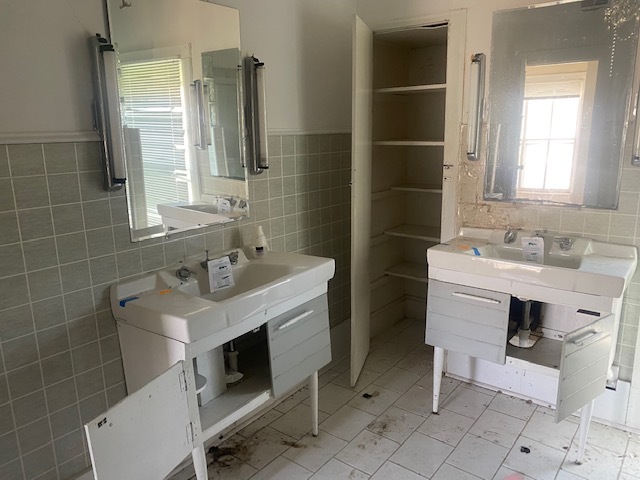 930 North Main Street Rochelle, IL 61068 - Photo 15 of 18 a bathroom with a sink toilet a mirror and shower