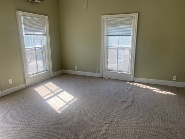 930 North Main Street Rochelle, IL 61068 - Photo 10 of 18 an empty room with windows