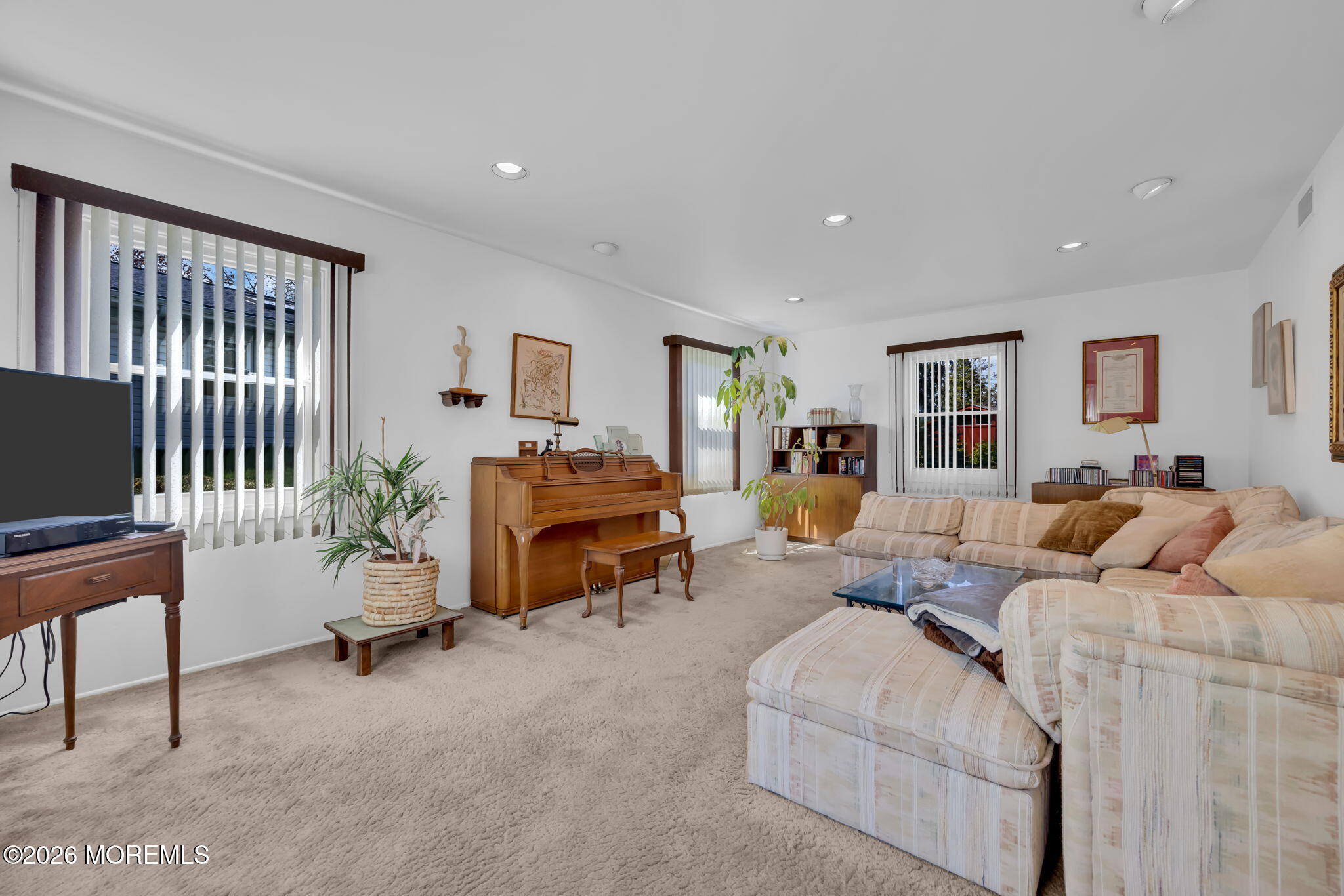 37 Faith Lane Aberdeen, NJ 07747 - Photo 11 of 36 a living room with furniture and a flat screen tv