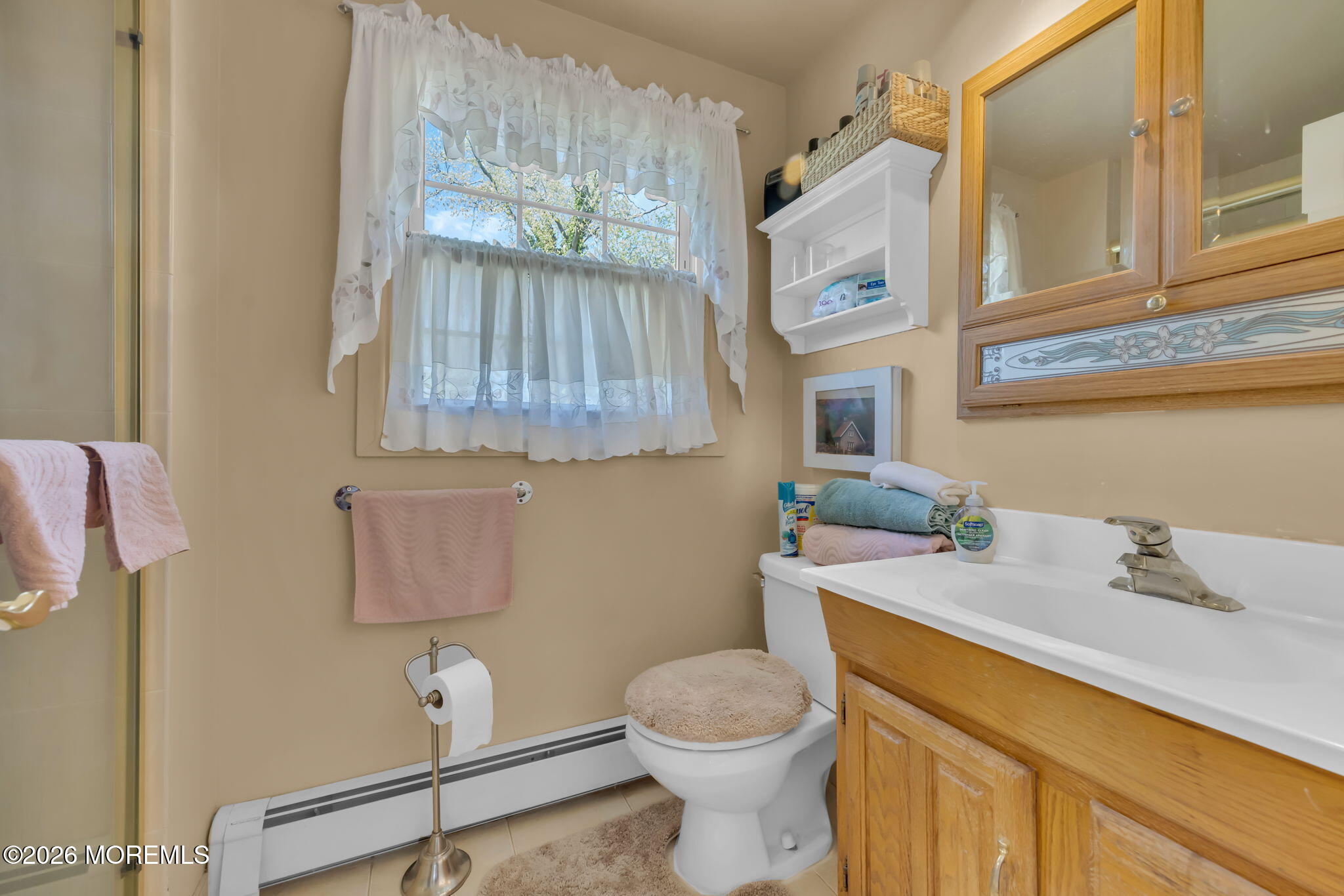 37 Faith Lane Aberdeen, NJ 07747 - Photo 29 of 36 a bathroom with a sink a toilet and vanity