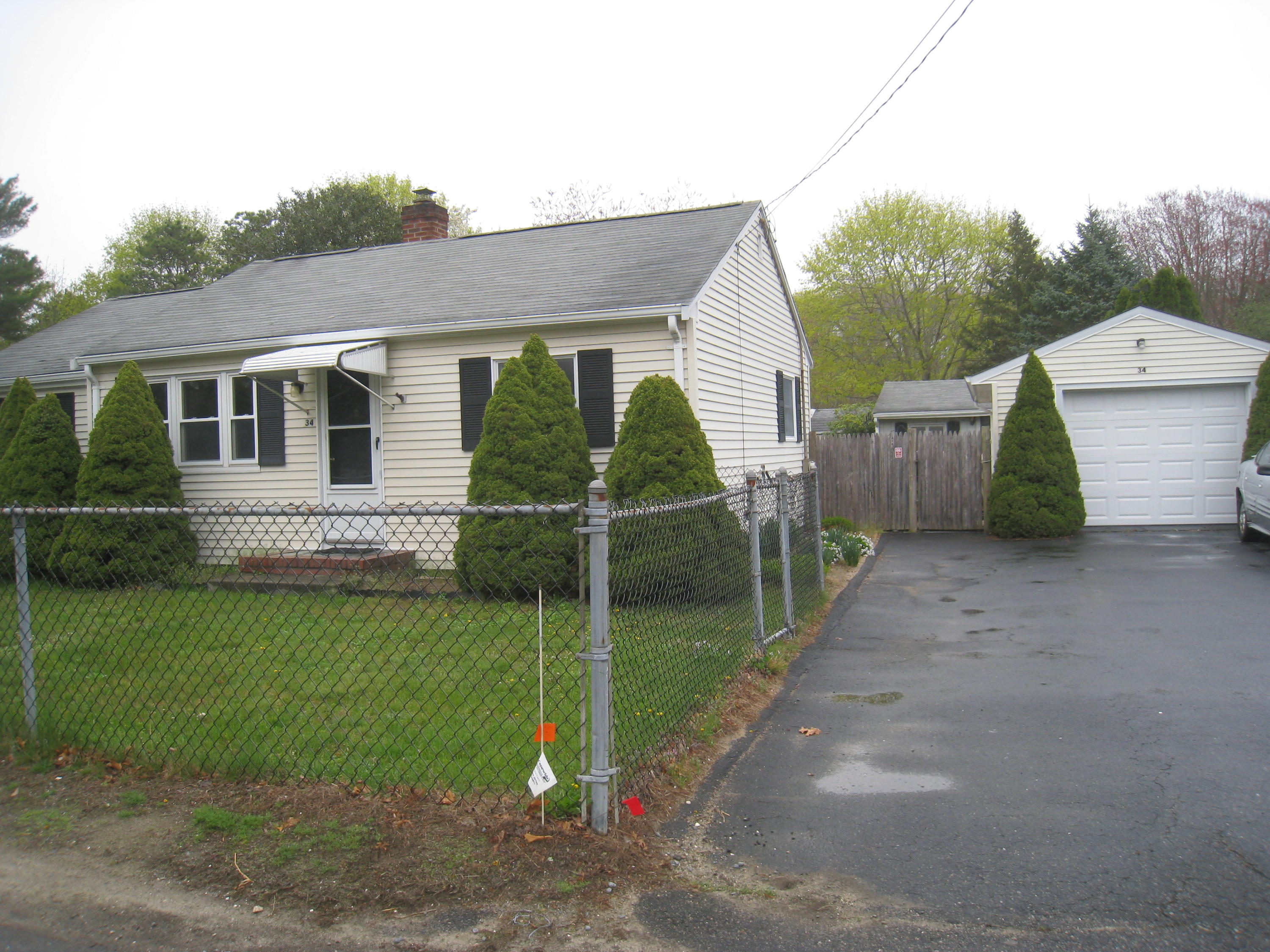 34 Tevyaw Road Hyannis, MA 02601 - Photo 1 of 28 a view of a house with a backyard and a road