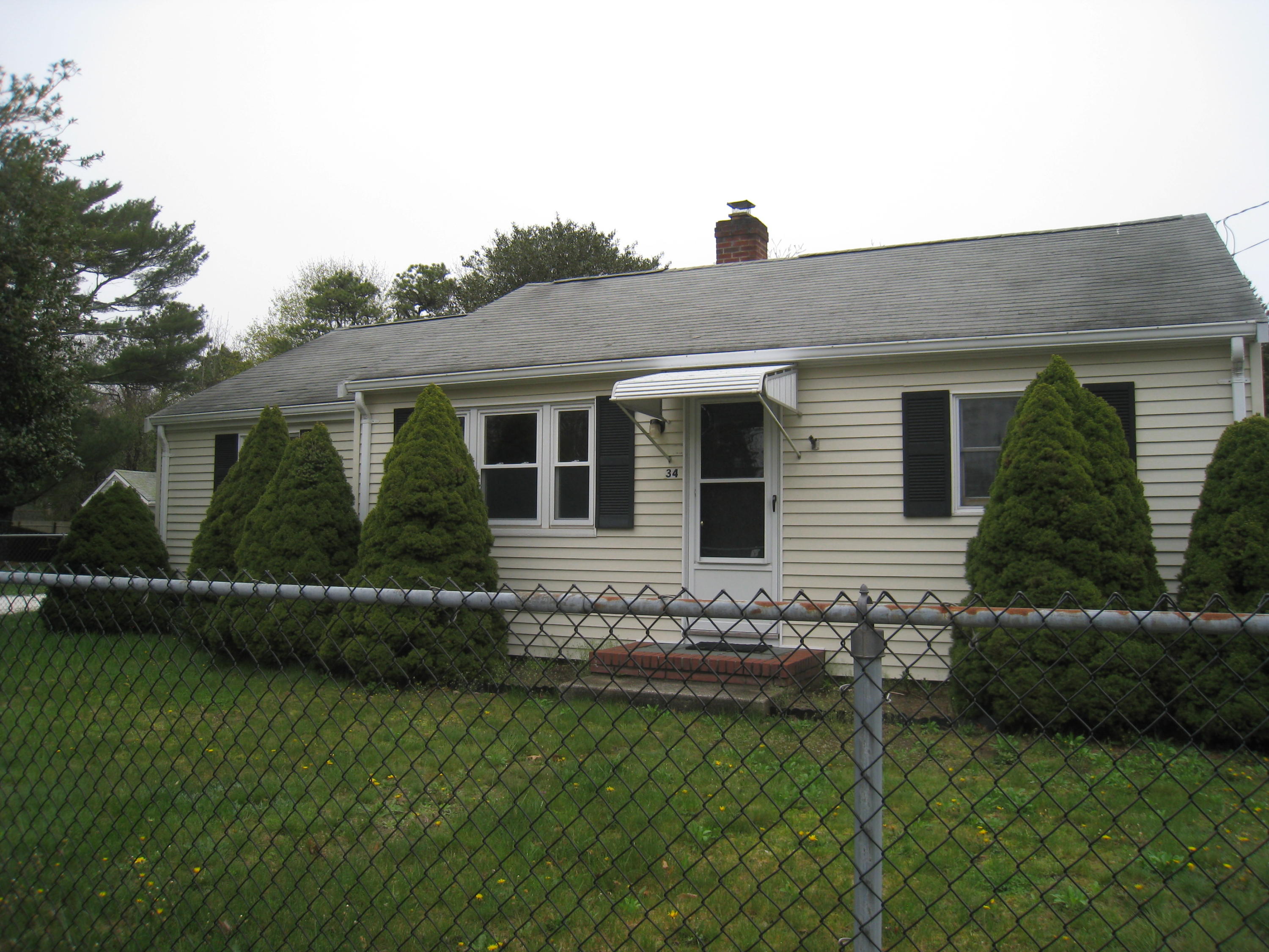 34 Tevyaw Road Hyannis, MA 02601 - Photo 2 of 28 a backyard of a house with lots of green space