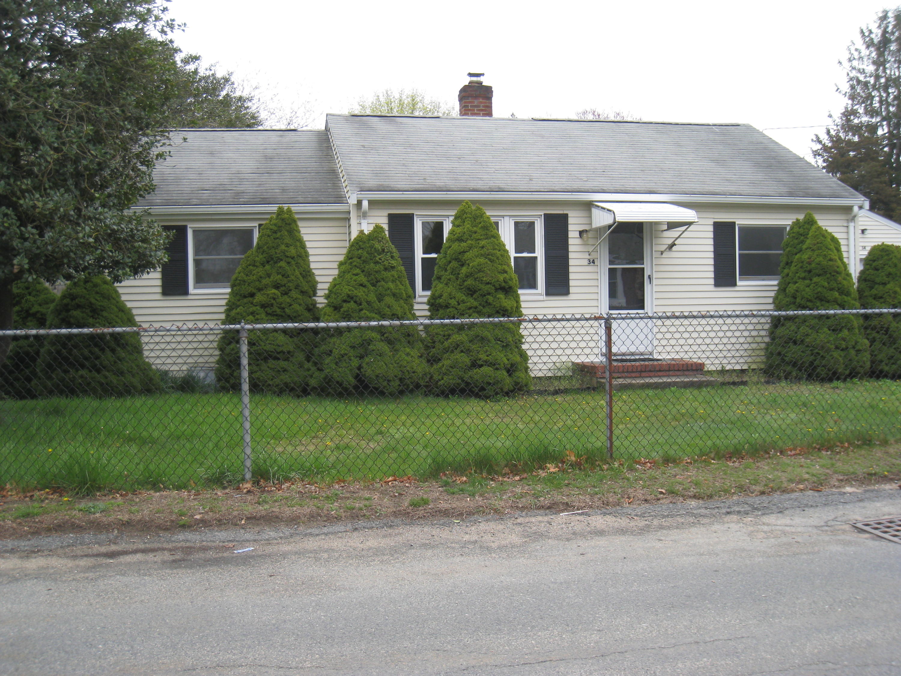 34 Tevyaw Road Hyannis, MA 02601 - Photo 4 of 28 a front view of a house with a garden