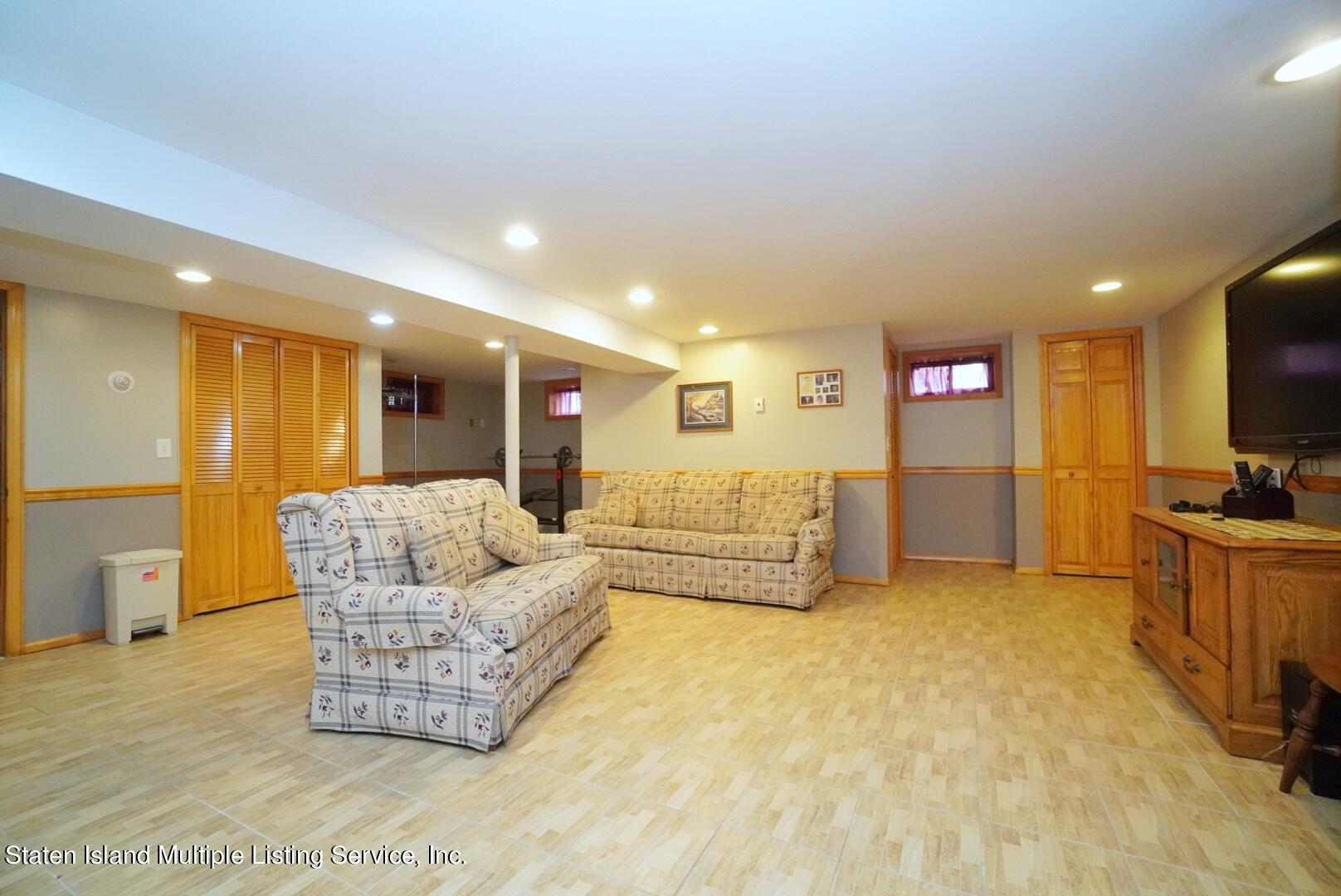 111 Medford Road Staten Island, NY 10304 - Photo 23 of 35 (23) FULL FINISHED BASEMENT