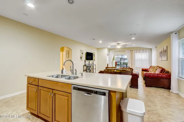 a kitchen with stainless steel appliances granite countertop a sink and cabinets