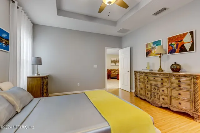 a bedroom with a bed and cabinets