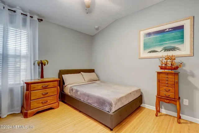 a bedroom with a bed and a furniture