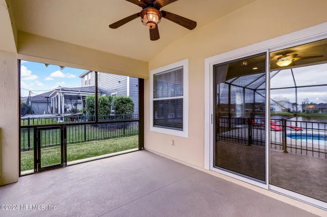 a view of a swimming pool with a porch