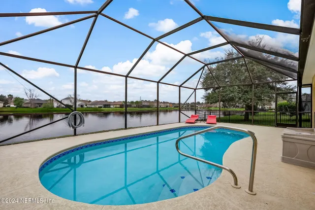 a view of a swimming pool with a patio