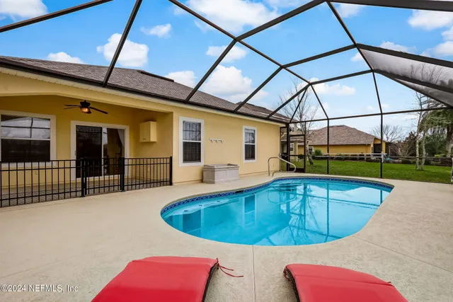a view of a lake with houses in the back