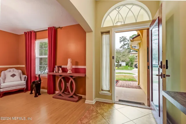 a view of a livingroom with furniture and a window