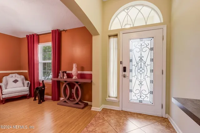 a view of a livingroom with furniture gym equipment
