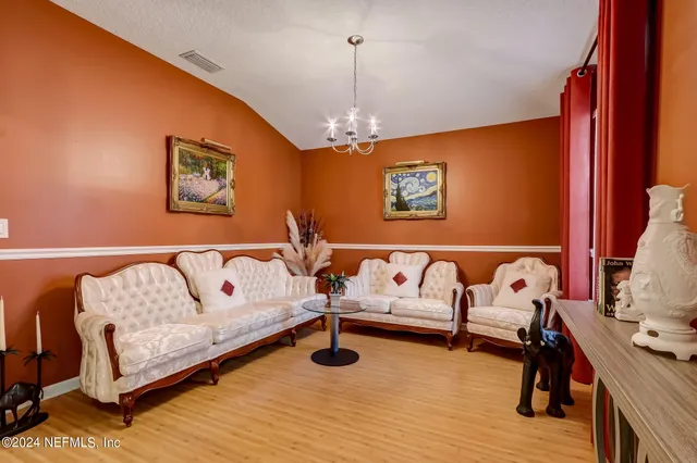 a spacious bedroom with a bed and a couch