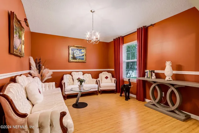 a bed room with furniture and window