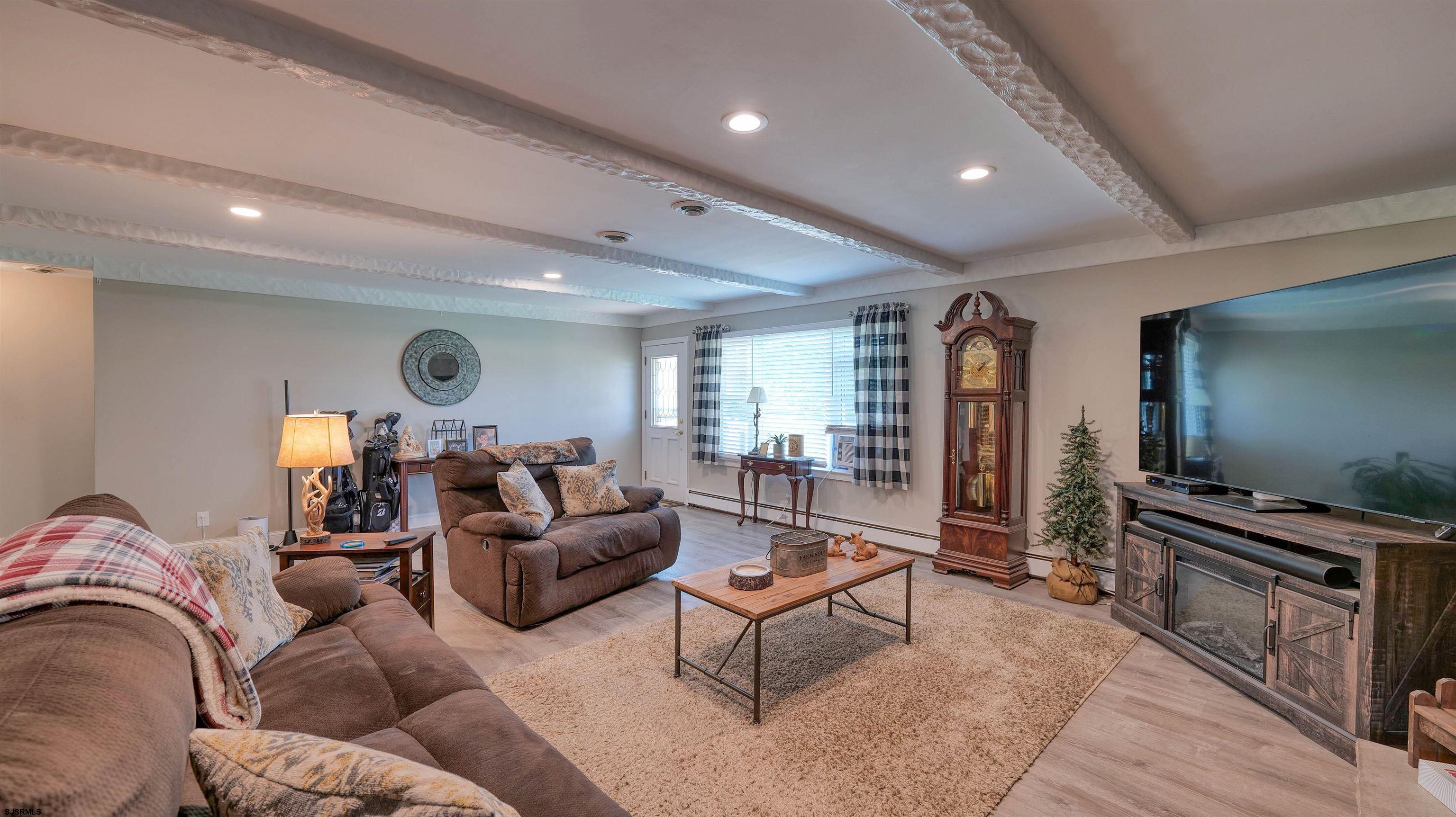 328 Llewellyn Avenue Richland, NJ 08350 - Photo 12 of 44 a living room with furniture and a flat screen tv