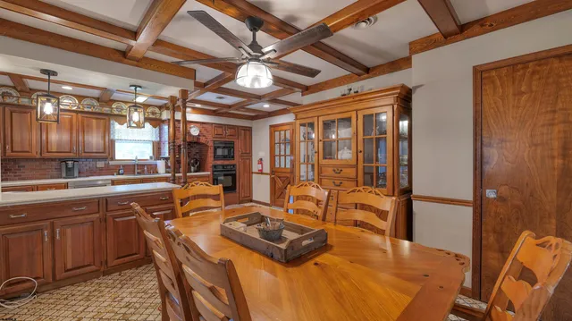 a kitchen with stainless steel appliances granite countertop a sink a stove and a refrigerator