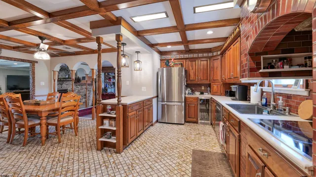 a open kitchen with stainless steel appliances granite countertop a stove and cabinets