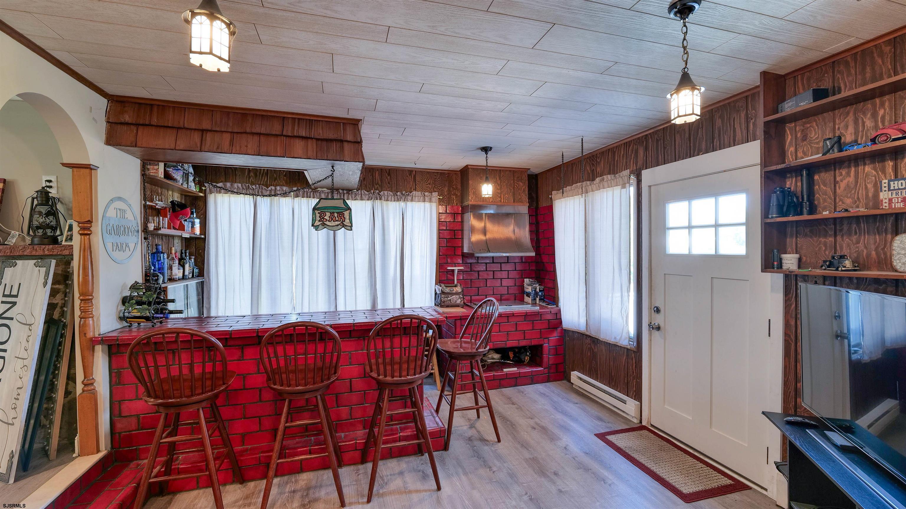 328 Llewellyn Avenue Richland, NJ 08350 - Photo 20 of 44 a dinning room with furniture and a flat screen tv