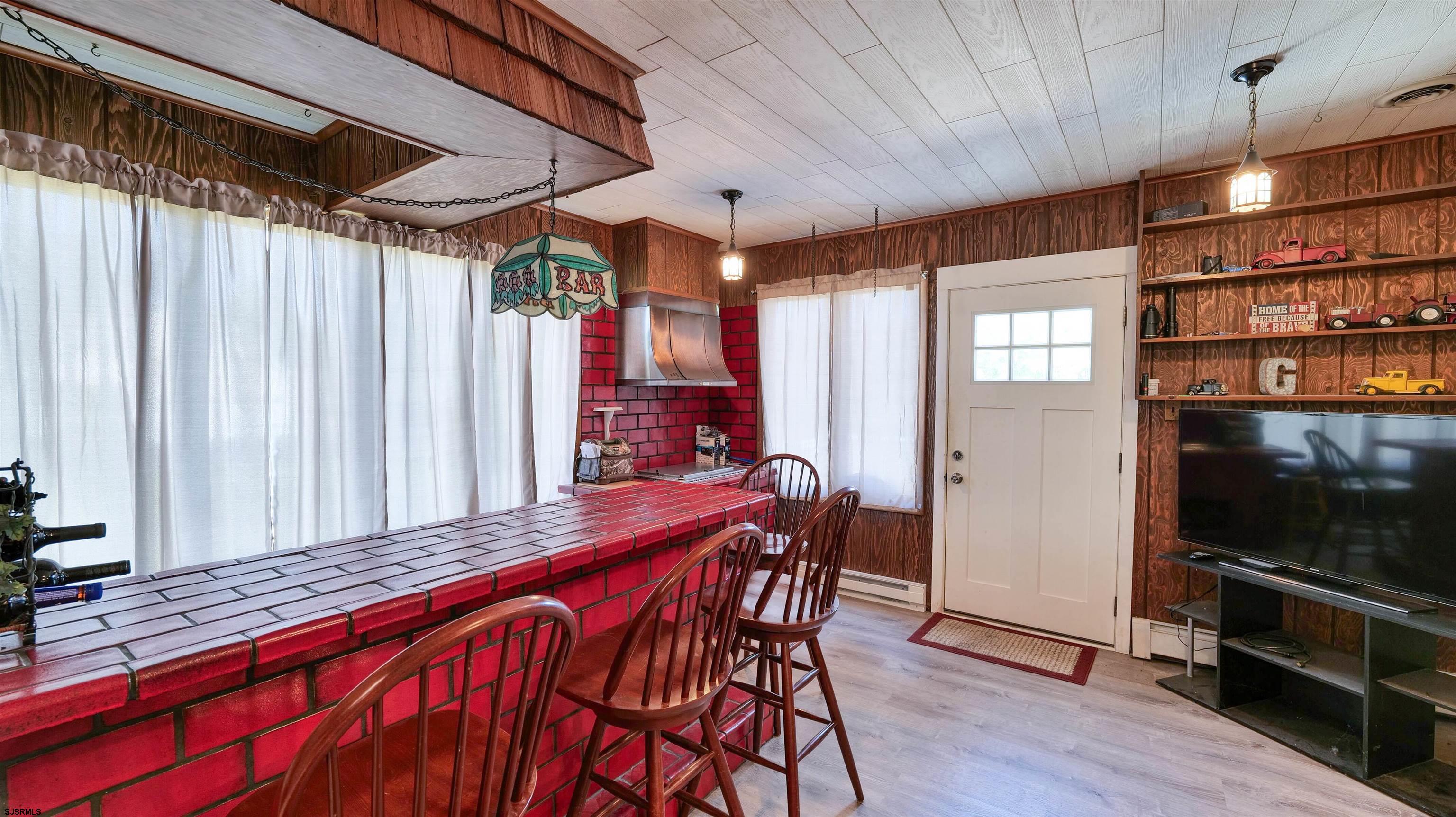328 Llewellyn Avenue Richland, NJ 08350 - Photo 21 of 44 a outdoor space with a large window and wooden floor