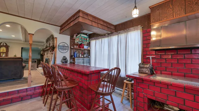 a outdoor dining space with furniture and a potted plant