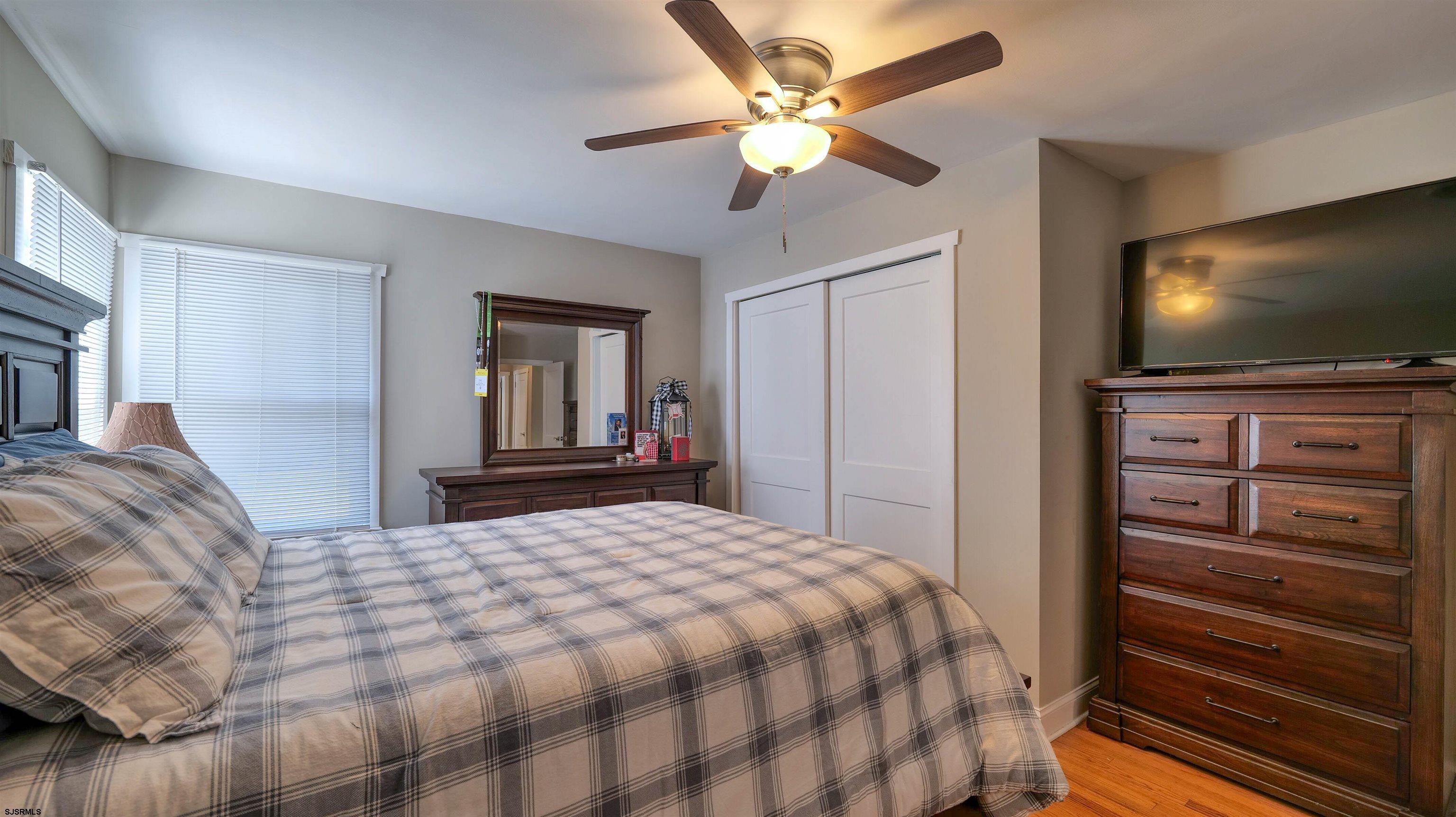 328 Llewellyn Avenue Richland, NJ 08350 - Photo 25 of 44 a bedroom with a bed and a flat screen tv